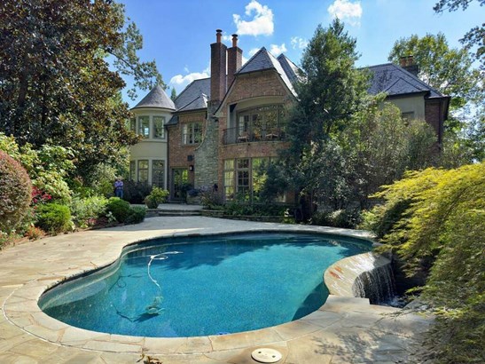 Pool surrounded by beautiful landscaping for maximum privacy