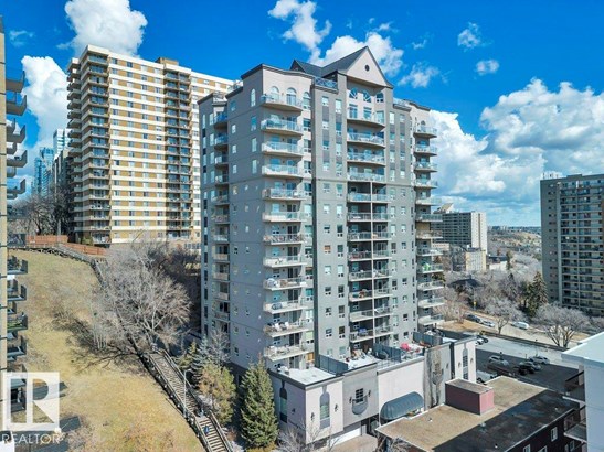 View of apartment building / complex featuring a city view