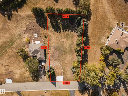 Aerial view of property and surrounding area with property parcel outlined