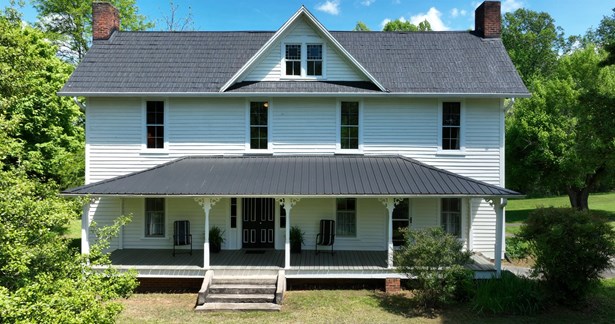 Home built in 1885 sitting on 6.15 acres with 350 ft. of Roaring River Frontage.  This home is MOVE IN READY!