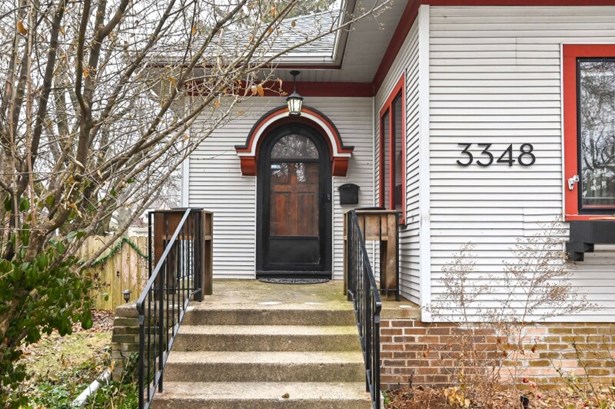 Handsome bungalow w/porch hood