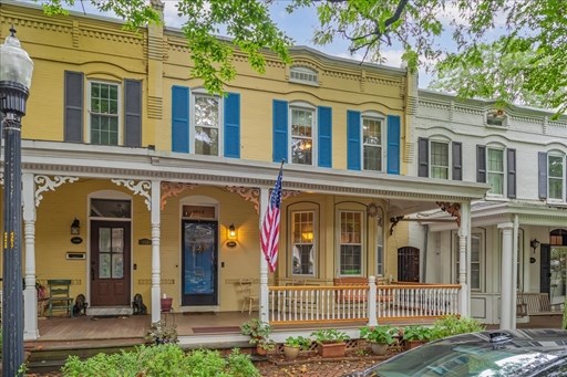 Cheery curb appeal on beautiful paver-lined street