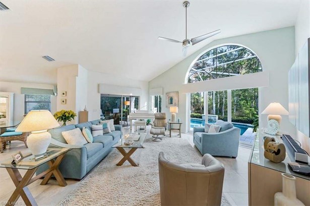 Living room with views of the pool